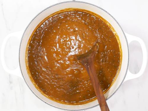 slow cooking dal makhani in a white pot