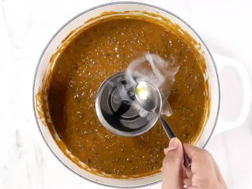 smoking dal makhani with a wood coal