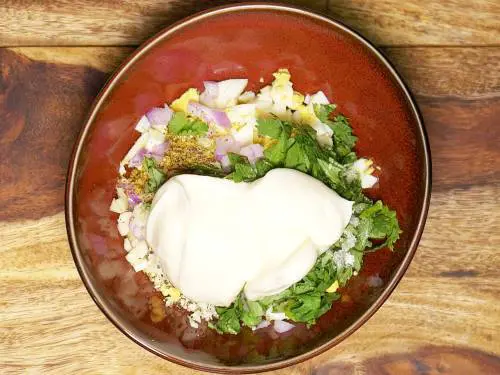 adding mayo to mixing bowl