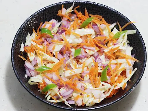 mixed veggies in a black bowl