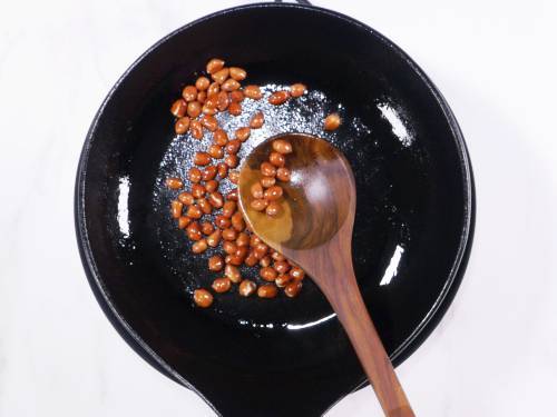 roasting peanuts in a pan