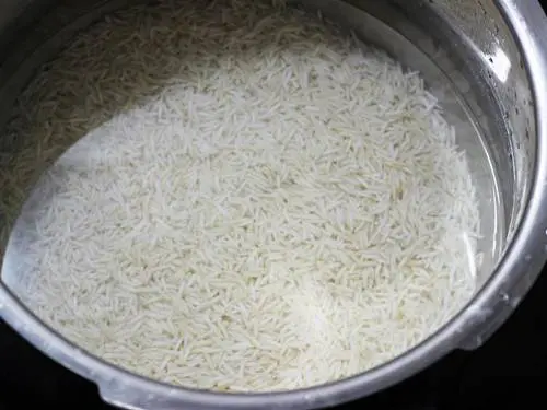 cooking rice to make lemon rice