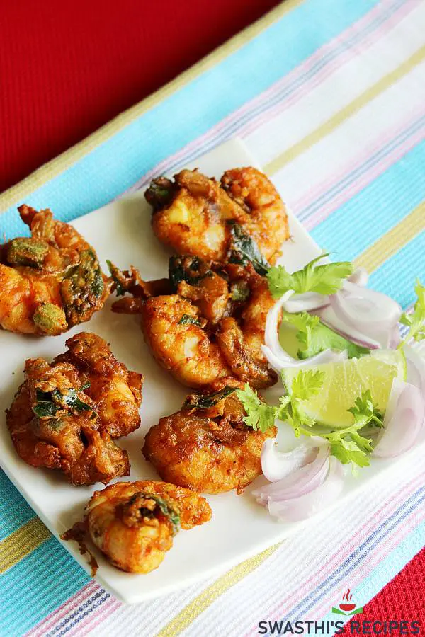 shrimp pakora in a white plate