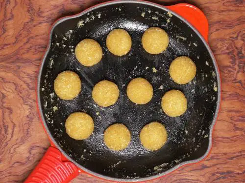 coconut ladoos with jaggery in a pan