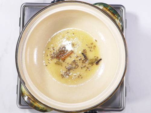 frying spices in butter for palak paneer