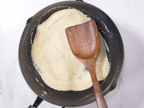 cooling roasted rava to make laddu