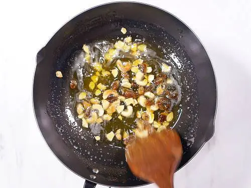 fried cashews and raisins in ghee to make rava ladoo