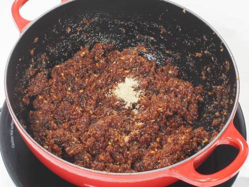 adding nutmeg and cardamom powder
