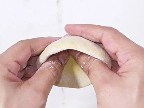shaping dough to make bobbatlu