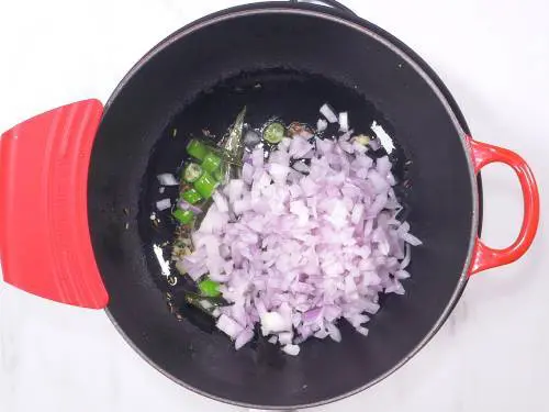 sauteing onions to make zucchini curry