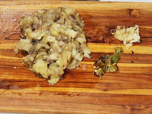 chopped baingan garlic and chilies for making bharta