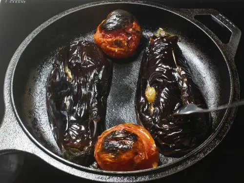 broiled eggplants tomatoes in a pan