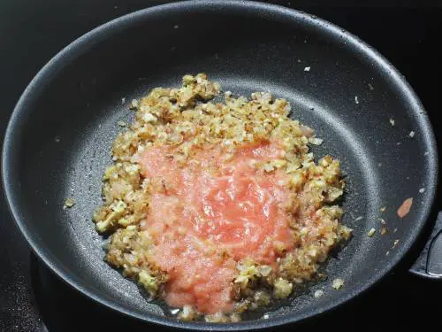 adding tomato puree