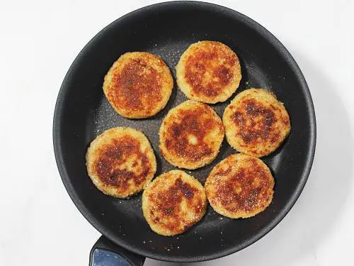 crisp fried potato patties in pan