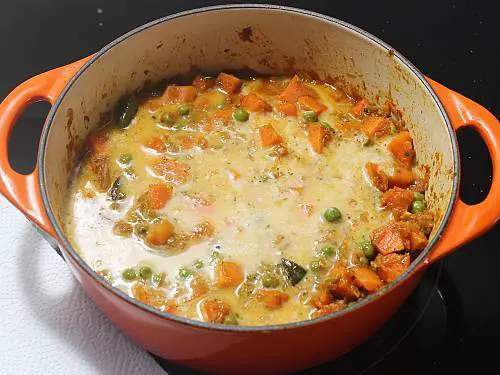add coconut milk to make carrot curry