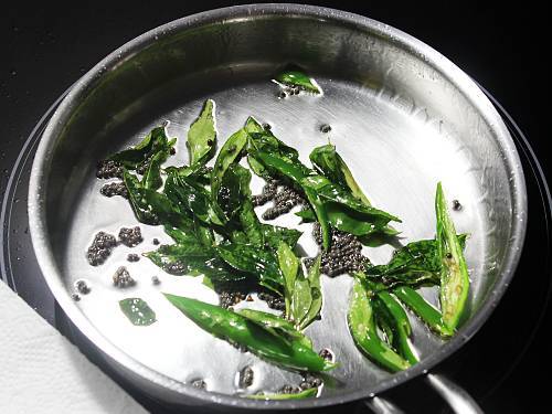 adding mustard, chilies & curry leaves to tempering