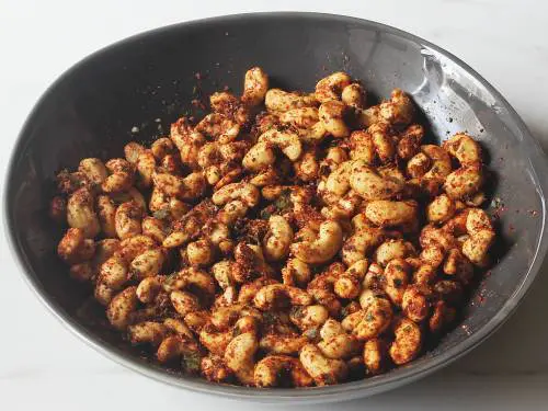 spiced cashews ready for roasting