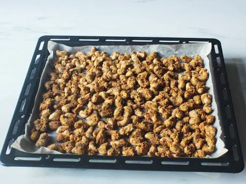 roasted cashews cooling on the rack