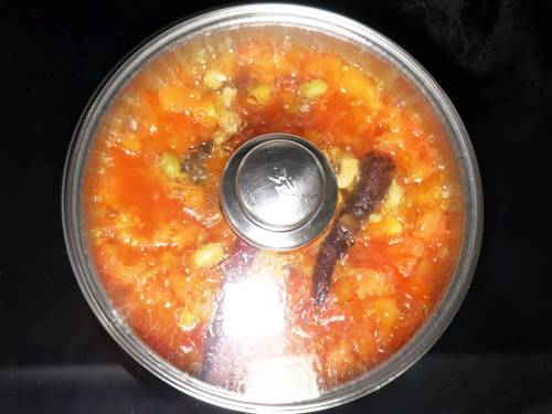 simmering tomatoes in a pan