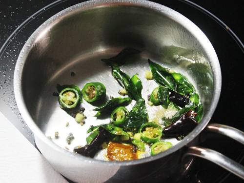 tempering with curry leaves and chilies