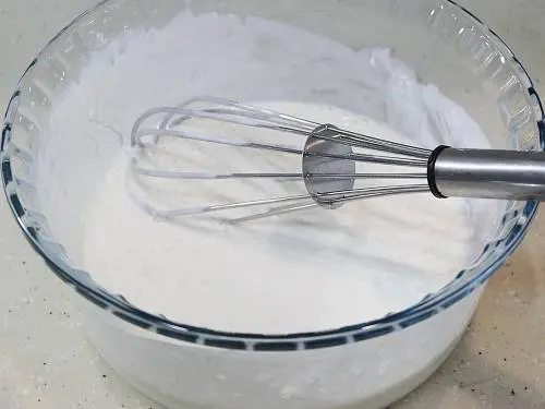 whisking yogurt to make perugu vada