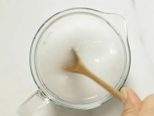 mixing cornstarch or arrowroot powder with water 
