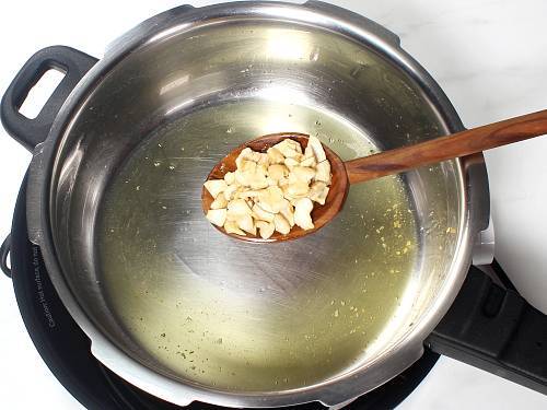 frying cashews in ghee to make besan ladoo