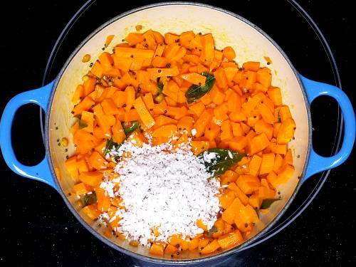 add fresh grated coconut to carrot poriyal