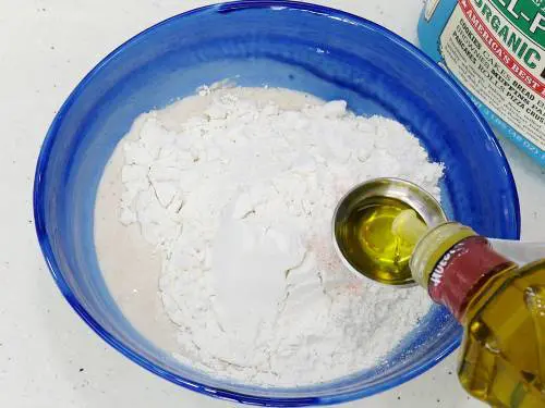 how to learn to make pizza add flour oil and salt to the yeast mixture