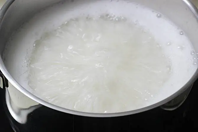 cooking rice in pot for fried rice