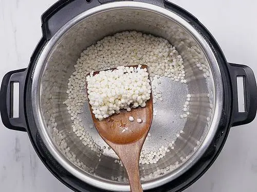 popped sago in a spatula to make payasam