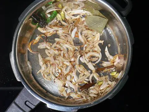 golden onions in a pressure cooker