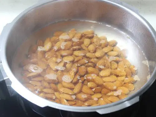 add almonds to hot water