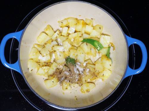 garam masala and salt over aloo methi