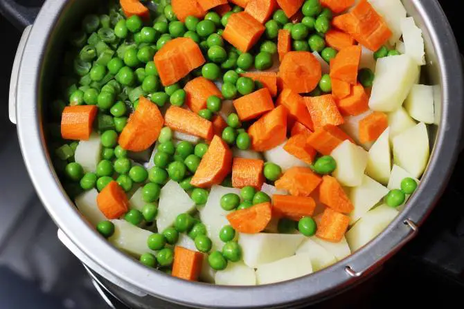 add carrots and peas to the steam basket