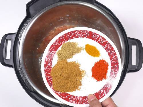 add spices to the onion tomato masala