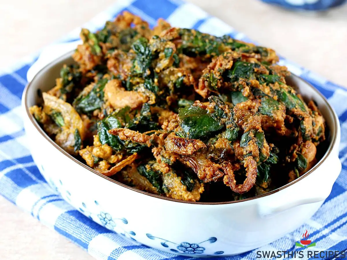 palak pakoda spinach pakora served in a white bowl