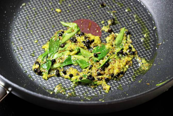 tempering ingredients in a pan