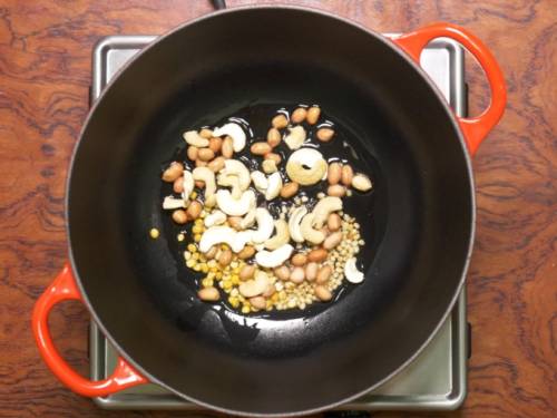 frying peanuts and cashews to make upma recipe