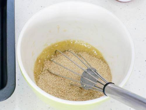 adding sugar to banana bread batter