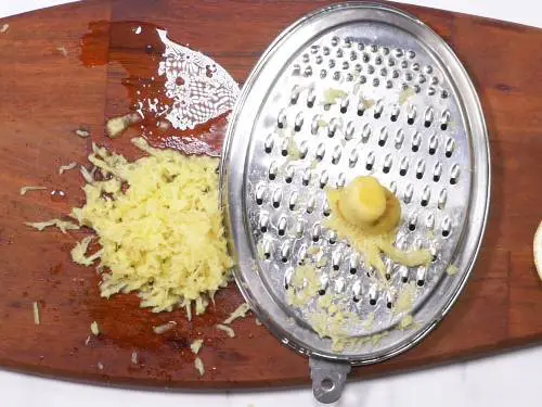 grated ginger on a chopping board