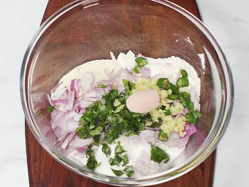 curry leaves ginger green chilies and salt in a bowl