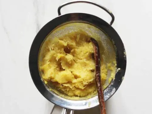 pineapple pulp in a strainer