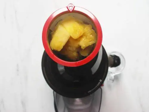 pineapple juice in a slow juicer
