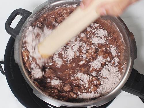 stir flour with wooden stick