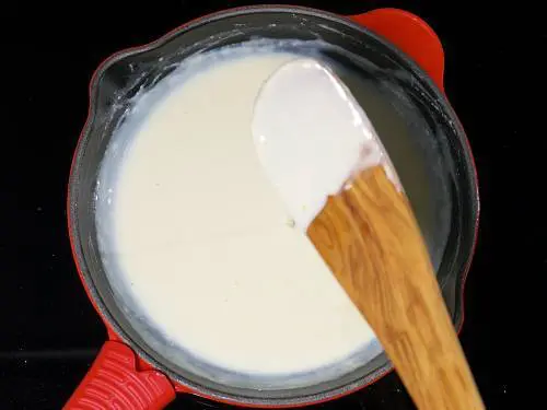 thick creamy white sauce in pan