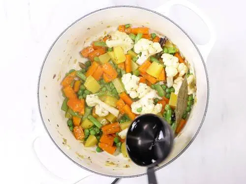 pour water to cook vegetables