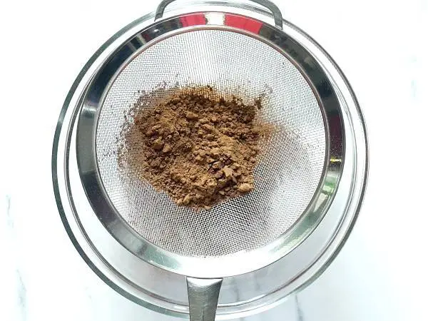add cocoa powder to a sieve