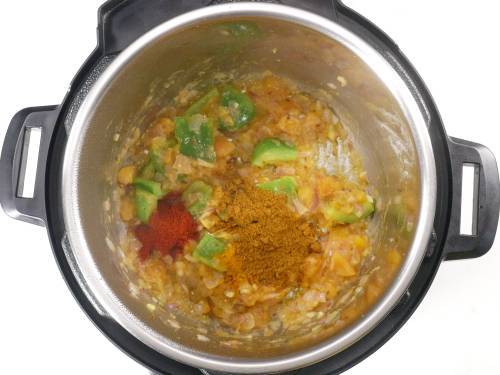 adding masala to make pav bhaji