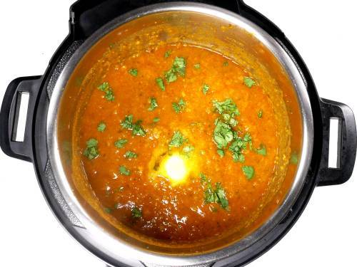 butter and coriander leaves garnished over bhaji